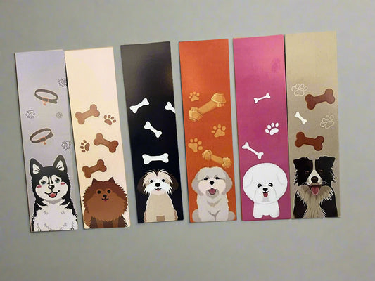 Set of colorful bookmarks with dog illustrations on a tiled background