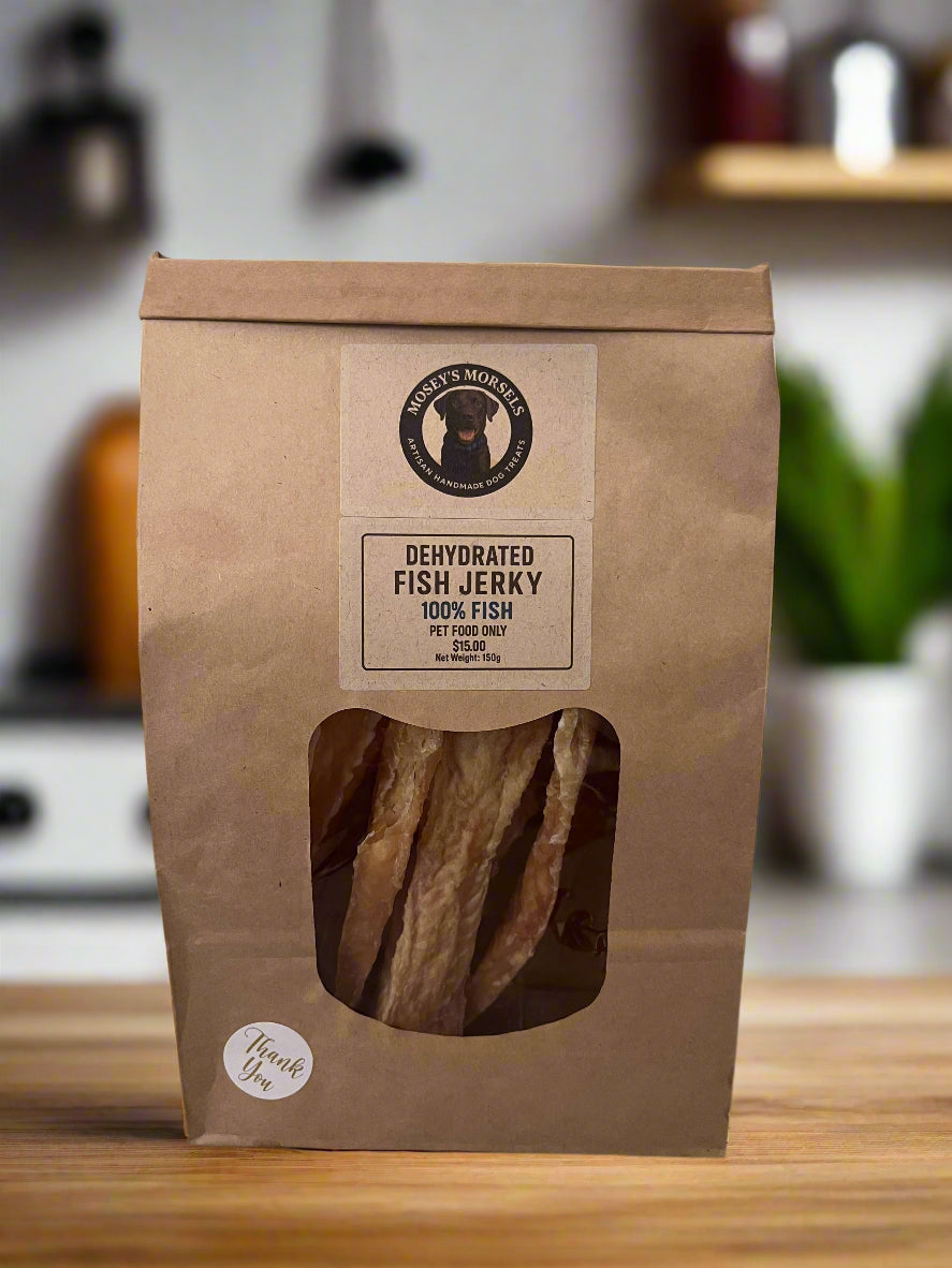 Dehydrated fish jerky package with a label on a white surface.