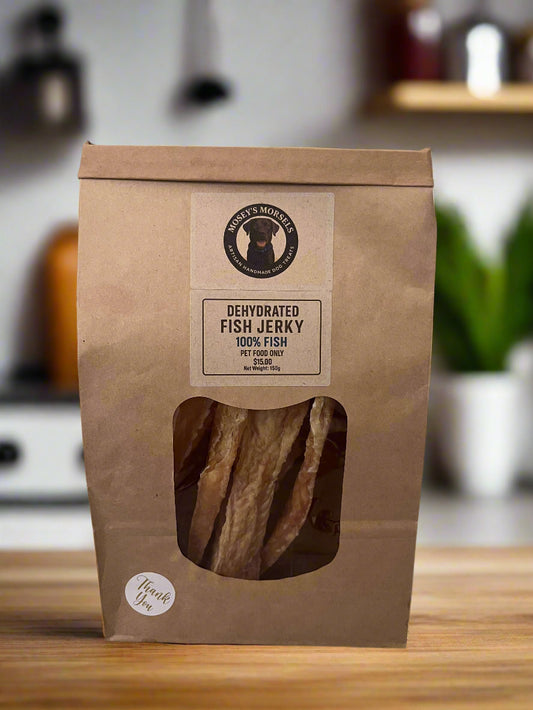 Dehydrated fish jerky package with a label on a white surface.