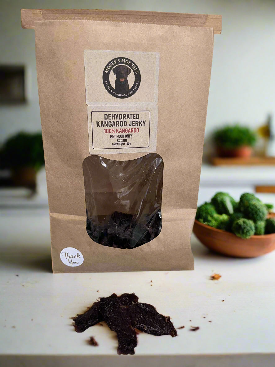 Dehydrated kangaroo jerky package on a cutting board with a visible brand label.