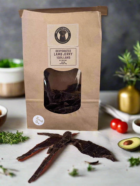Dehydrated lamb jerky with a brown paper bag packaging on a white surface.